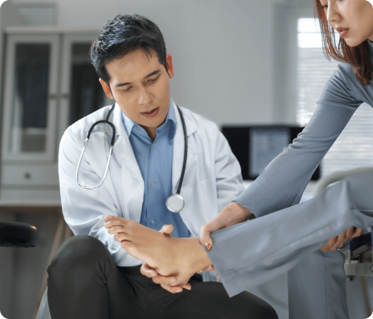 Podiatrist examining a patient’s foot